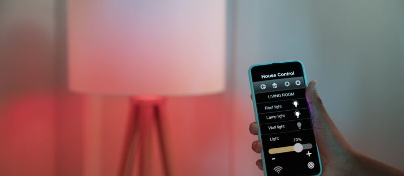 hand-holding-smartphone-home (2) (1) (1)