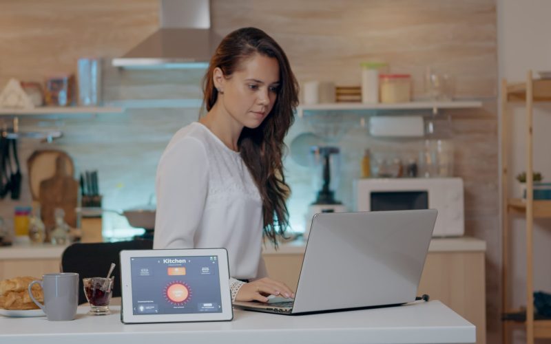 woman-using-voice-activated-smart-wireless-lighting-app-tablet (1) (1)